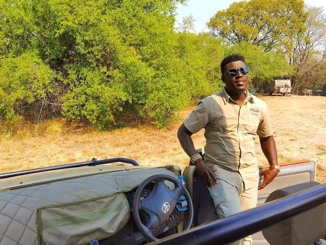 Guide and safari vehicle ready for a hosted journey